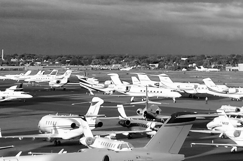 Busy airport ramp with many aircraft